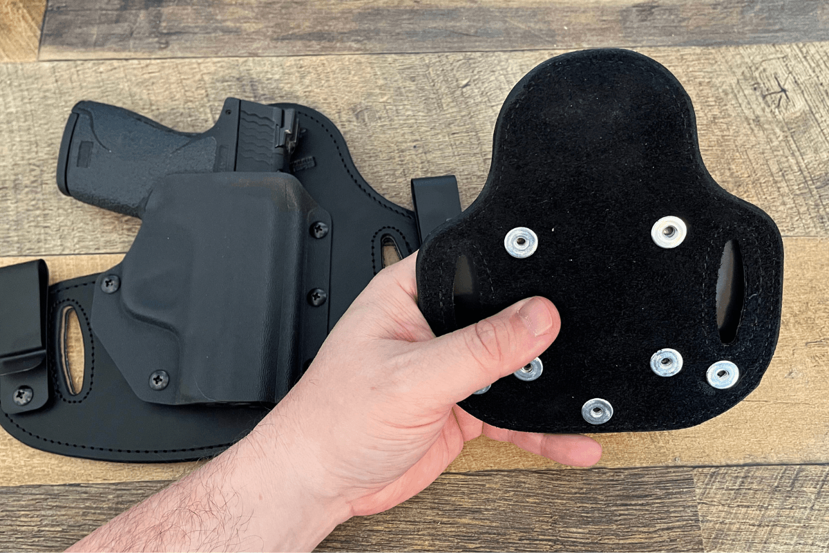 Corey Rawlins showing his Hidden Hybrid Holster mag carrier and its soft backing.